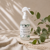 Dot & Lil Eucalyptus & Lime Air + Linen Mist in a frosted glass bottle with a white trigger spray.